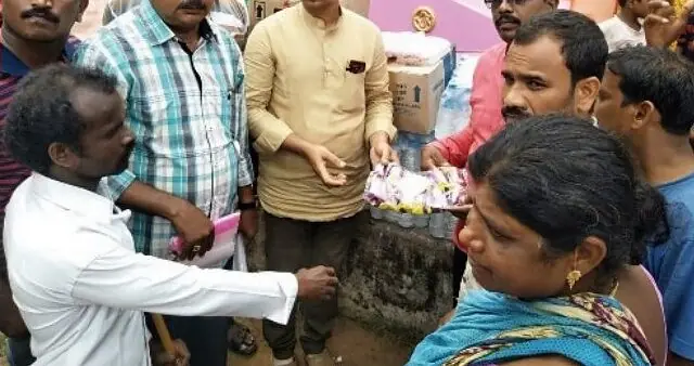 Relief supplies being handed out to villagers after Cyclone Titli