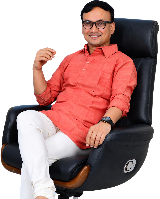 Portrait of Dr. Daneti Sridhar, smiling, seated in a black chair